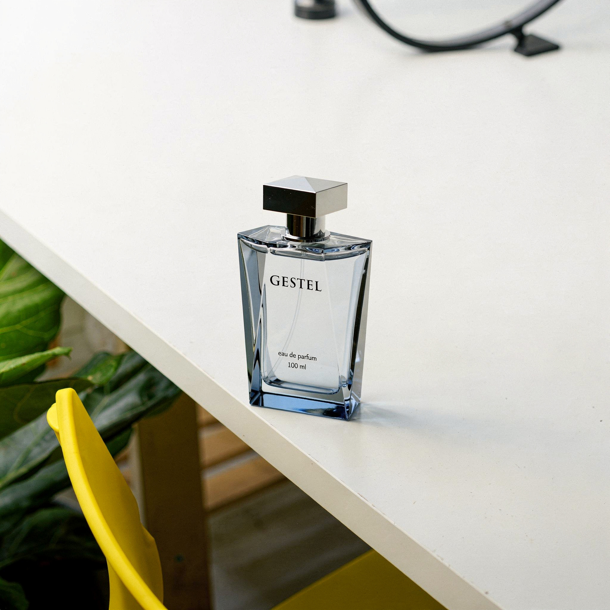 {
  "scene": "A clean, minimalist workspace scene based on the setting and layout of image 1, featuring a bright white desk surface. The scene includes various professional tech accessories like a bla