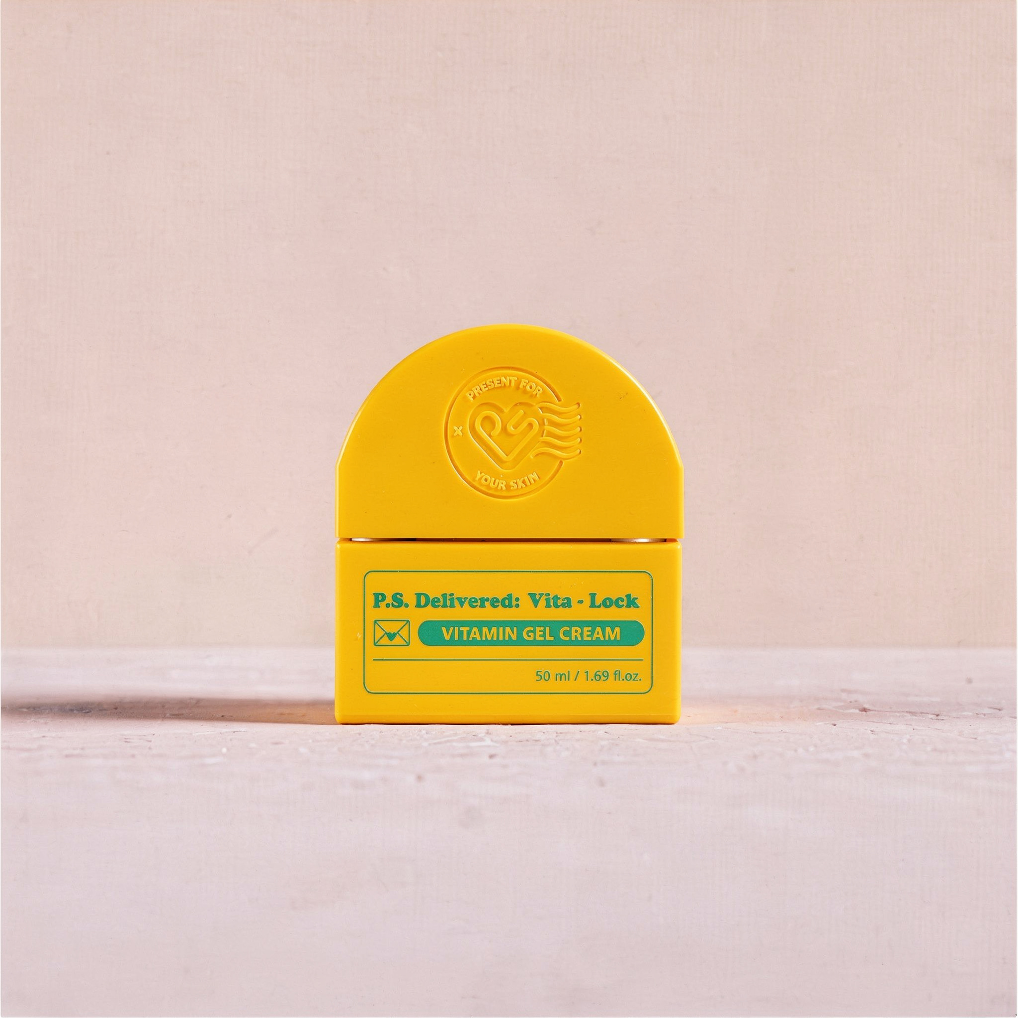 {
  "scene": "A minimalist product photography scene from image 1, featuring a smooth pastel pink background wall and a textured, slightly porous light pink flat surface. The original product has been