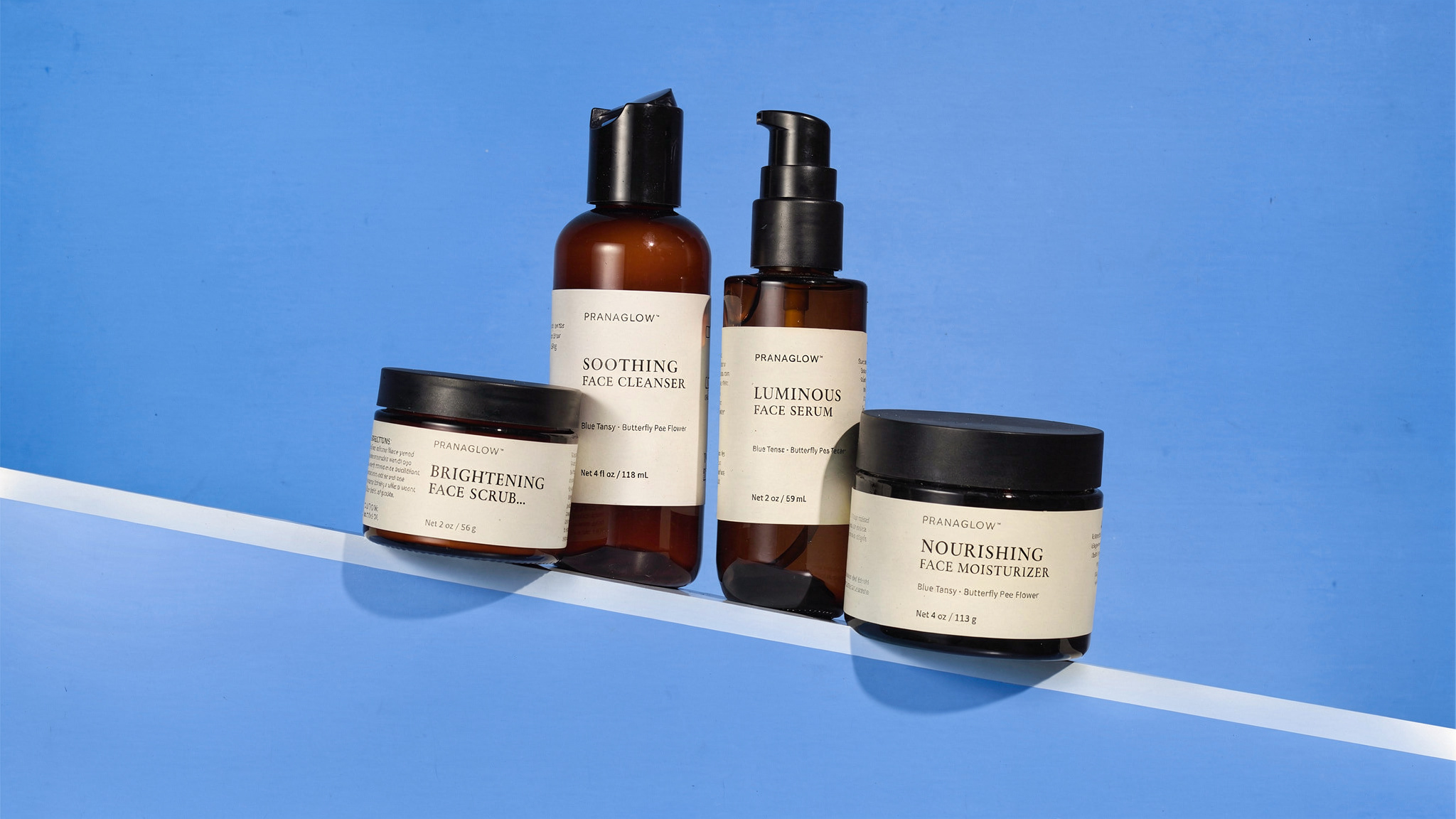 {
  "scene": "A vibrant editorial product photography scene replicating the setting from image 1. The background is a solid, bright light blue flat surface featuring a crisp, straight white diagonal l