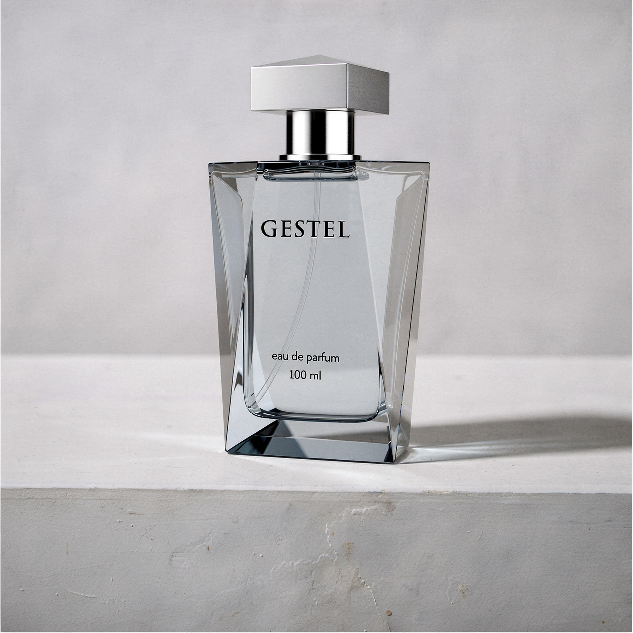 {
  "scene": "A professional product photography shot where the perfume bottle from image 2 is placed into the minimalist setting of image 1. The bottle stands on the same textured, weathered white co