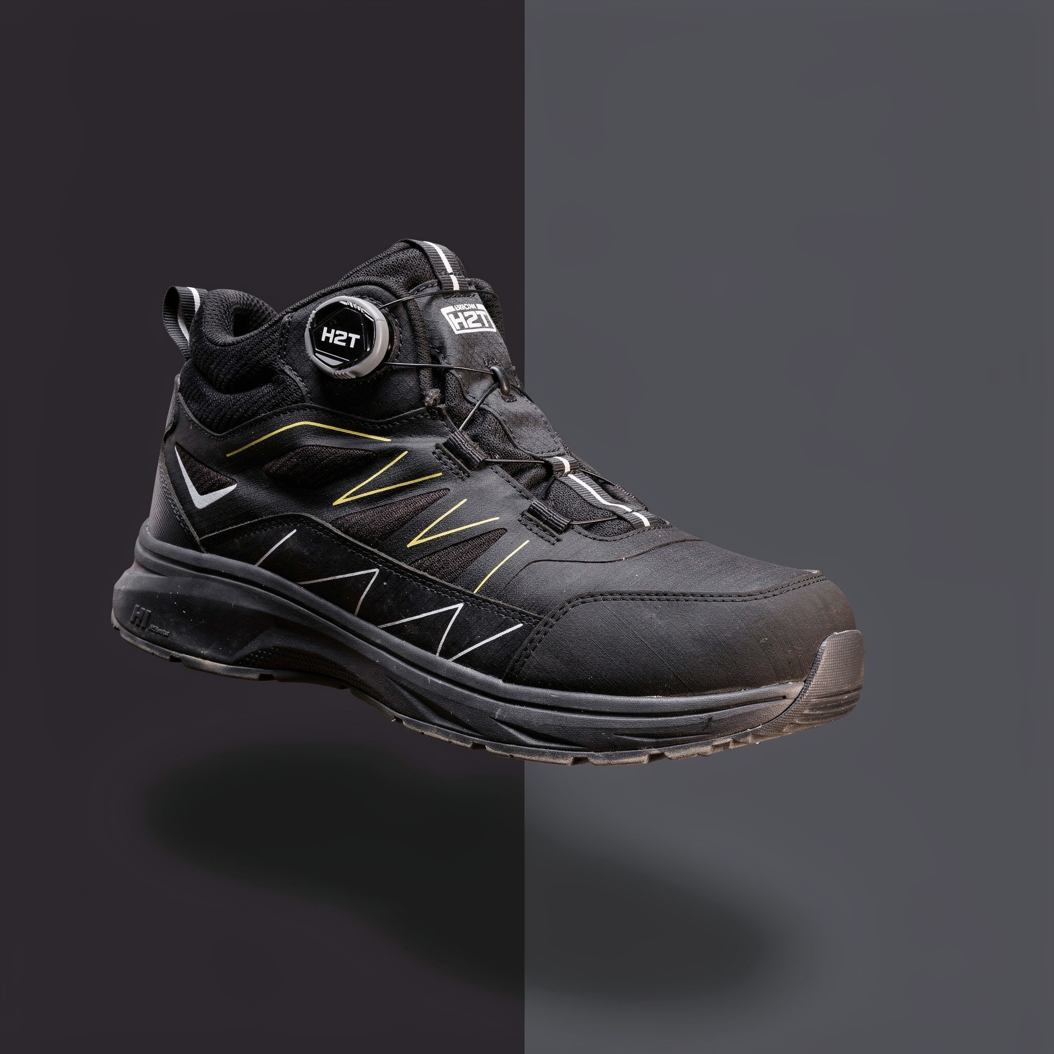 {
  "scene": "A minimalist commercial product shot placing the shoe from image 2 into the exact environment of image 1. The background is a crisp vertical split, with deep charcoal black on the left s